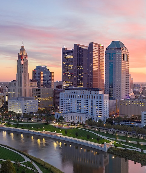 Columbus, Ohio city skyline with view of the river at dusk