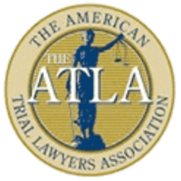Circular gold and gray logo of The American Trial Lawyers Association, featuring a silhouette of Lady Justice holding scales, with ATLA in large white letters across the center.