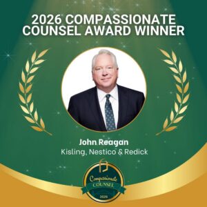 A graphic announces John Reagan from Kisling, Nestico & Redick as the 2026 Compassionate Counsel Award winner. His portrait is centered, with laurel graphics and a green and gold background.
